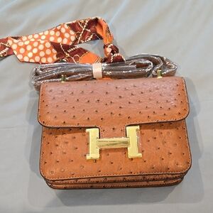 Brown and Gold Crossbody Bag with Structured Design